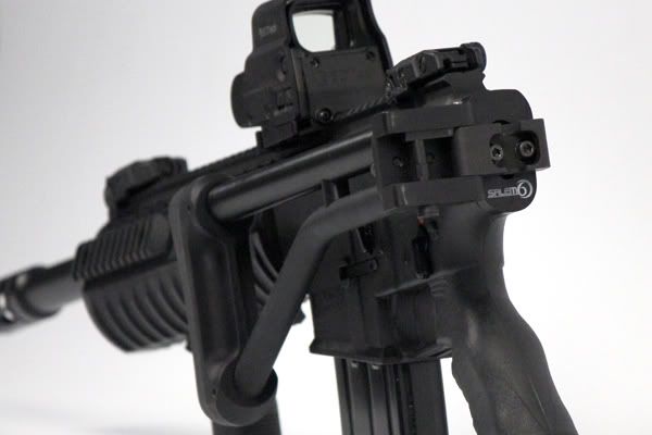 Side folding stock adapter